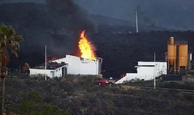 Lava from La Palma volcano burns cement plant, prompting lockdown