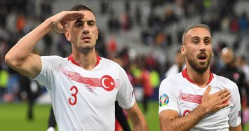 Turkey players celebrate goal against France with military salute