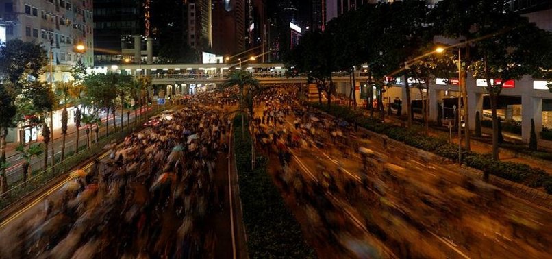 THOUSANDS PROTEST MASK BAN AS HK LEADER TOUGHENS STANCE