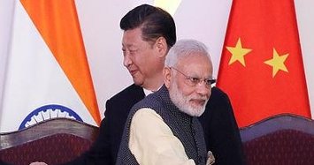 India and China agree to speed border troop pull back