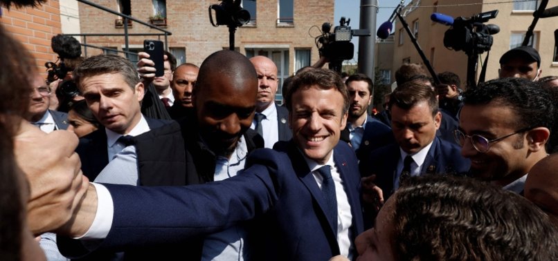 MACRON, WITH EYE ON PARLIAMENTARY VOTE, VISITS LEFT-LEANING PARIS SUBURB