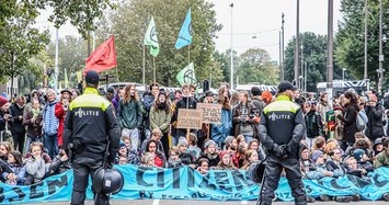Climate activists block roads, stage protests around world