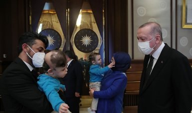 Turkish president meets conjoined twins post-surgery
