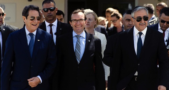 Anastasiades (L), Akıncı (R) and Eide (C) arrive to give a press conference following a meeting on the ongoing peace talks on Sept. 14, 2016 at the now defunct Nicosia airport in the UN-controlled buffer zone. (AFP Photo)