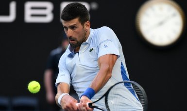 Djokovic battles past Fritz into Melbourne semi-final with Sinner