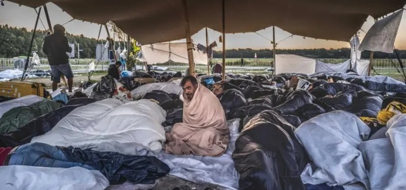 MIGRANTS SLEEPING OUTSIDE CROWDED DUTCH ASYLUM CENTRE PROMPT PROTESTS