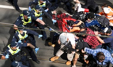 Police trampled, hundreds arrested in Melbourne anti-lockdown protest
