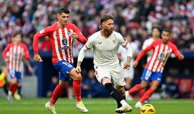 Ten-man Atletico edge Sevilla to climb to third in La Liga