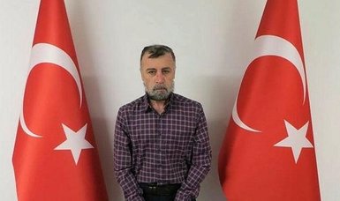 Wanted FETO-linked murder suspect brought back to Turkey, handed over to police
