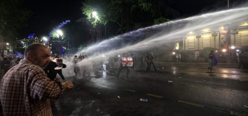 GEORGIAN POLICE FIRE TEAR GAS, WATER CANNONS AT PROTESTERS BY PARLIAMENT