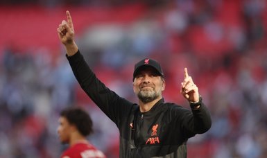 Liverpool manager Klopp plays down talk of quadruple win