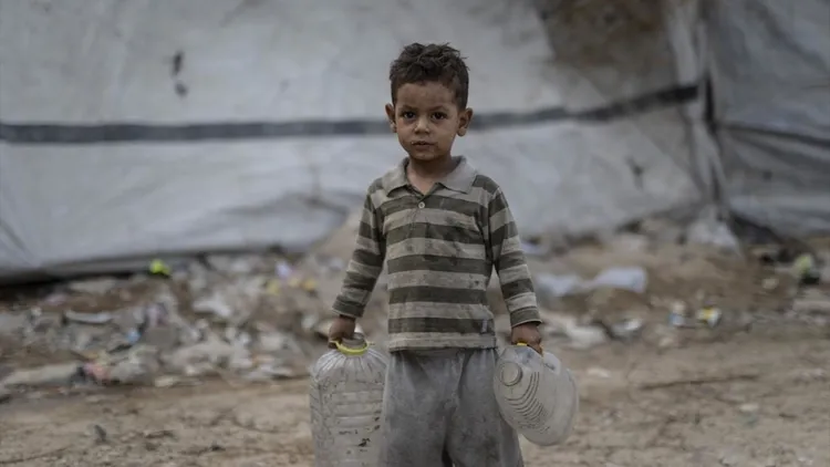 Displaced Gaza families struggle in tents near damaged Islamic University