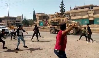 YPG/PKK terror group supporters stone US army vehicles in northern Syria