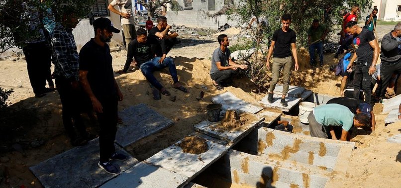 ISRAEL MASSACRES: MARTYRED GAZAN CIVILIANS LAID TO REST IN MASS GRAVES