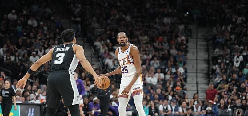 DEVIN BOOKER, KEVIN DURANT COMBINE FOR 57 AS SUNS CRUSH SPURS