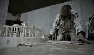 War-victim Syrian man uses art to keep ancient city of Palmyra alive