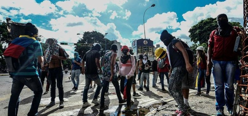 VENEZUELAN PROTESTERS TAKE TO STREETS TO DEFY MADURO