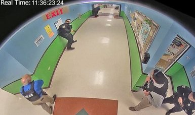 New video footage shows police waiting in Uvalde school