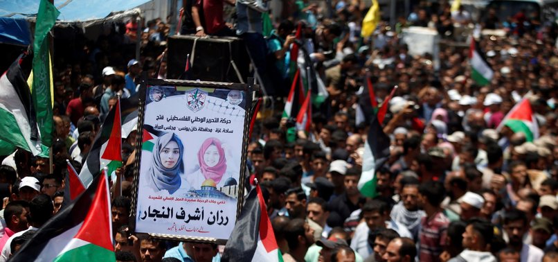 THOUSANDS AT FUNERAL FOR NURSE KILLED BY ISRAELI FIRE IN GAZA