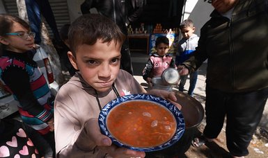 With no chance to celebrate Ramadan, Gazans gather at soup kitchens