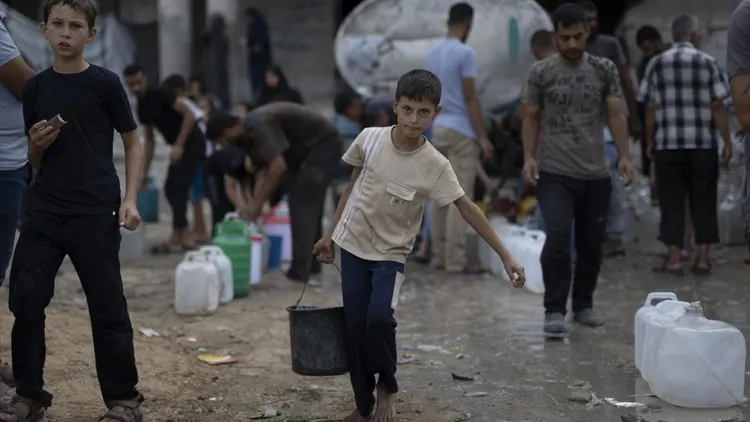 Displaced Gaza families struggle in tents near damaged Islamic University