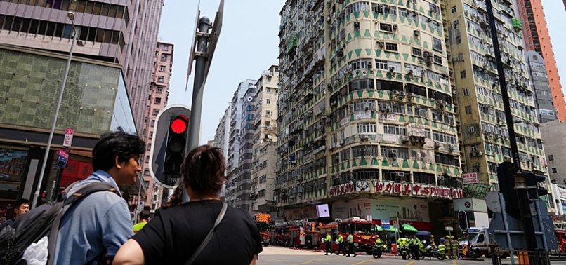 FIRE IN PACKED HONG KONG BUILDING KILLS FIVE，DOZENS IN HOSPITAL
