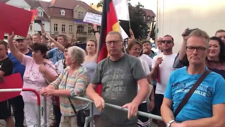Angry protesters boo German Chancellor Scholz at citizens' dialogue event