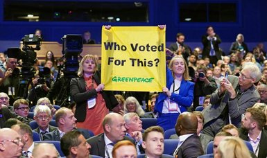 Greenpeace protesters disrupt British PM Truss's speech