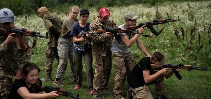 CHILDREN, TEENS RECEIVE ARMS TRAINING IN WESTERN UKRAINE FAR-RIGHT SUMMER CAMP