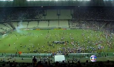 Pitch invasions force abandonment of two games in Brazil