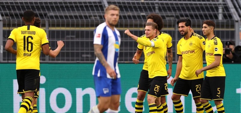 BORUSSIA DORTMUND BEAT HERTHA TO MAINTAIN FAINT TITLE HOPES