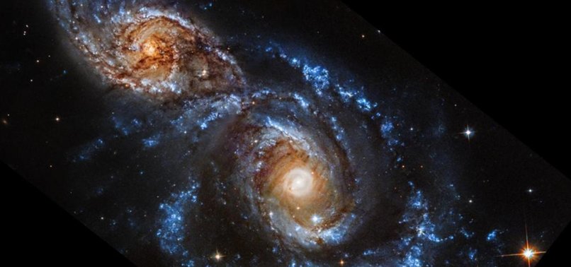 NASA REVEALS STUNNING IMAGE OF INTERACTING GALAXIES NGC 2207 AND IC 2163