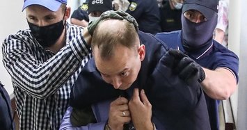 Russia to keep ex-journalist accused of treason behind bars