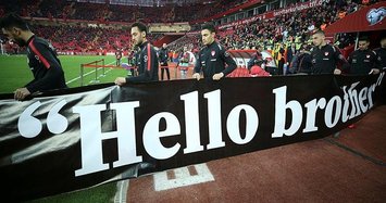 Turkish footballers hold 'Hello Brother' banners