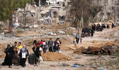 Palestinians in Gaza use truce to pick through rubble of homes