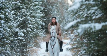 Kim rides white horse up North Korea's sacred peak