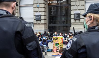 Police clear climate activists from heart of Zurich financial district