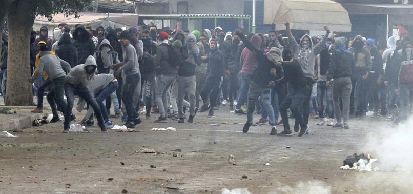 TUNISIAN POLICE AND PROTESTERS CLASH AFTER DEATH AT POLICE STATION