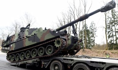 German conservative defends previous government's arms exports