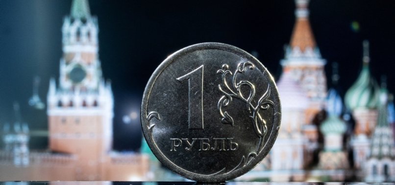 RUSSIAN ROUBLE RISES; GAZPROM SHARES PLUMMET ON NO-DIVIDENDS MOVE