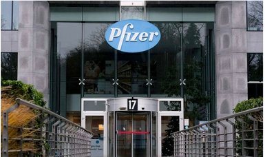 Vaccine maker Pfizer posts record revenues, sees slower 2023