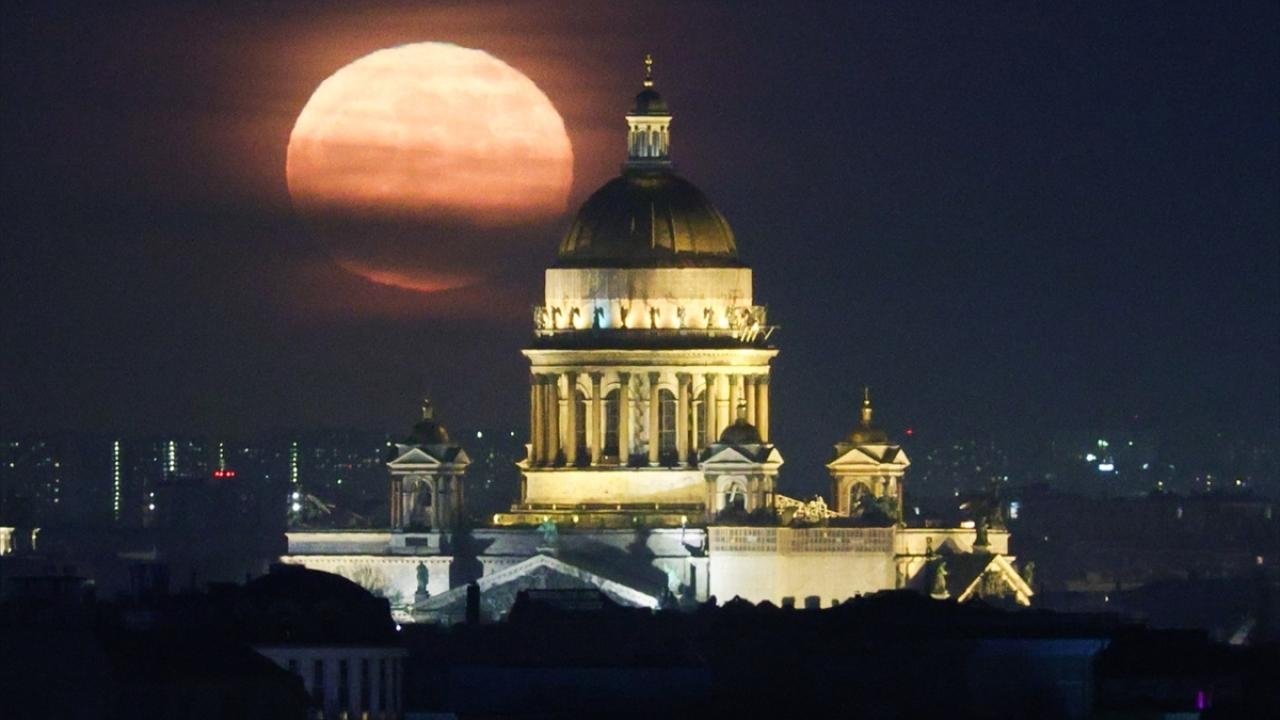 Full moon rises over St. Isaacs Cathedral in St. Petersburg
