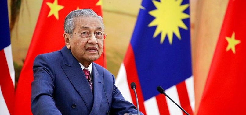 MAHATHIR FEARS NAJIB WOULD WALK FREE IF GRAFT-TAINTED PARTY WINS POLLS IN MALAYSIA