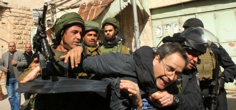 ISRAELI TROOPS LEAVE DOZENS OF PALESTINIAN ANTI-SETTLEMENT ACTIVISTS INJURED IN WEST BANK