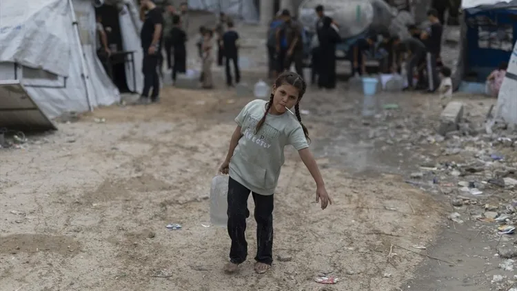 Displaced Gaza families struggle in tents near damaged Islamic University