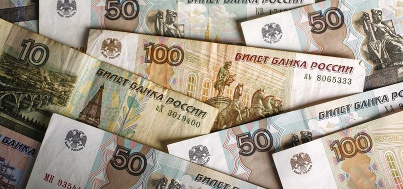 RUSSIAN ROUBLE SLIGHTLY STRENGTHENS AGAINST DOLLAR