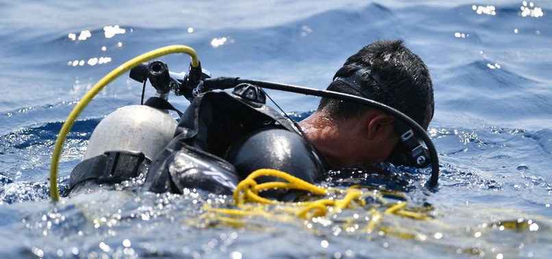 INDONESIAN DIVERS RECOVER CRASHED PLANES DATA RECORDER