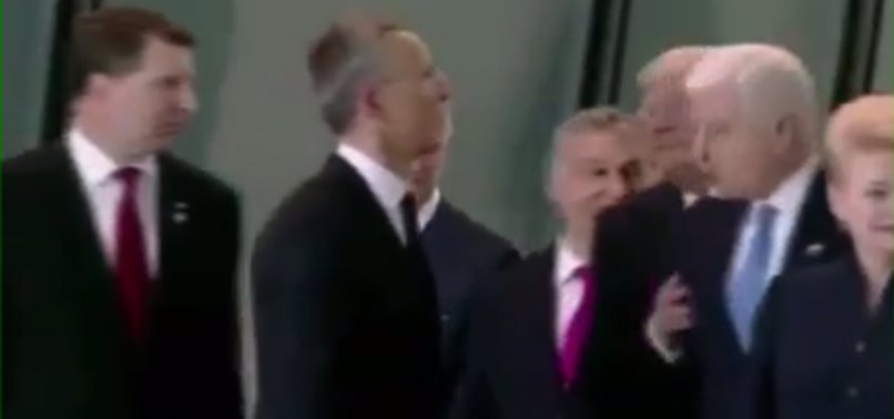 TRUMP SHOVES HIS WAY TO FRONT OF NATO GROUP PHOTO