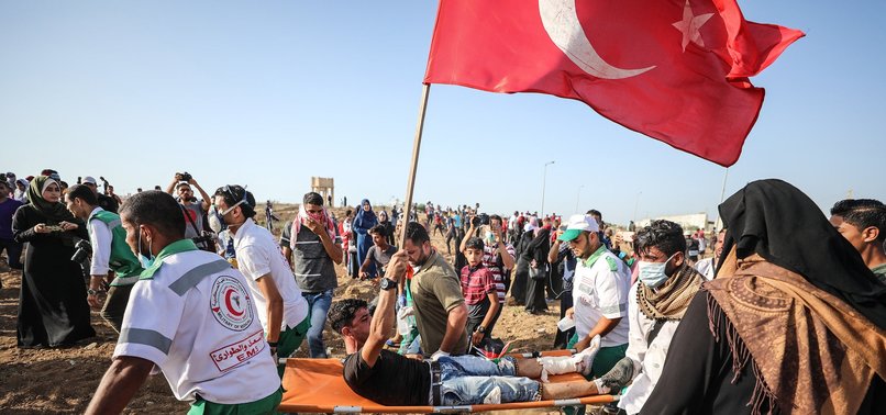 PALESTINIAN YOUTH WAVING TURKISH FLAG SHOT BY ISRAELI ARMY IN GAZA