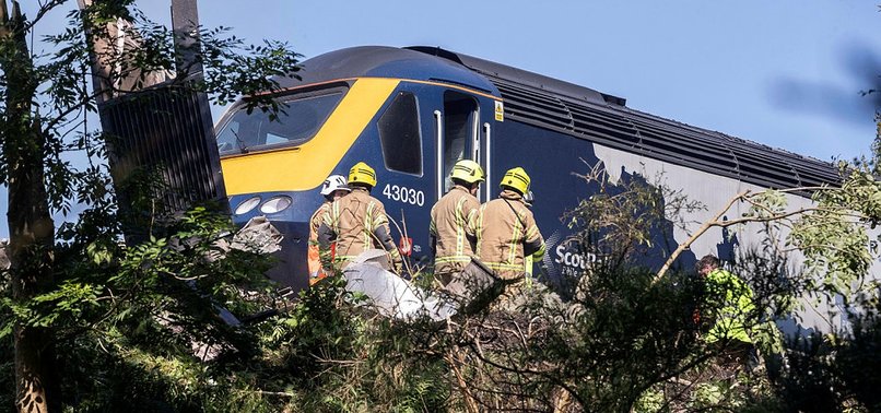 THREE DEAD IN SCOTLAND PASSENGER TRAIN DERAILMENT